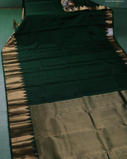 Pure kanchipuram silk saree green with plain body and temple design zari woven border