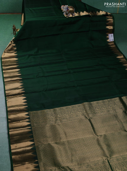 Pure kanchipuram silk saree green with plain body and temple design zari woven border