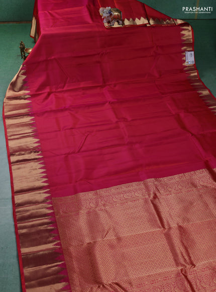 Pure kanchipuram silk saree dual shade of pinkish orange with plain body and temple design zari woven border