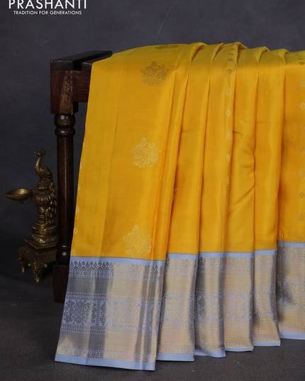 Pure kanchipuram silk saree yellow and grey with zari woven buttas and long zari woven korvai border