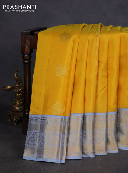 Pure kanchipuram silk saree yellow and grey with zari woven buttas and long zari woven korvai border