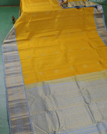 Pure kanchipuram silk saree yellow and grey with zari woven buttas and long zari woven korvai border