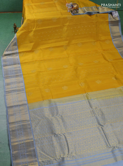 Pure kanchipuram silk saree yellow and grey with zari woven buttas and long zari woven korvai border