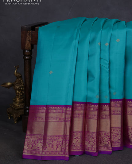Pure kanchipuram silk saree teal blue and purple with zari woven buttas and long zari woven korvai border