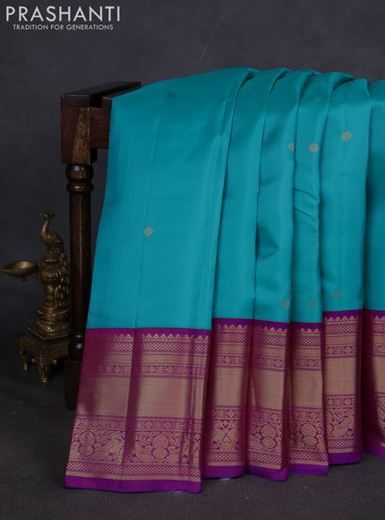 Pure kanchipuram silk saree teal blue and purple with zari woven buttas and long zari woven korvai border