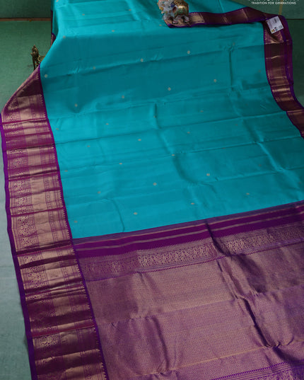 Pure kanchipuram silk saree teal blue and purple with zari woven buttas and long zari woven korvai border