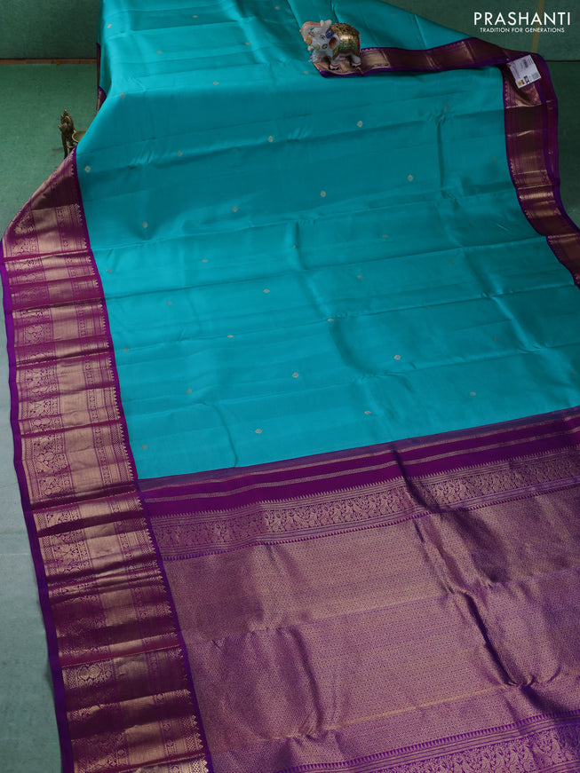 Pure kanchipuram silk saree teal blue and purple with zari woven buttas and long zari woven korvai border