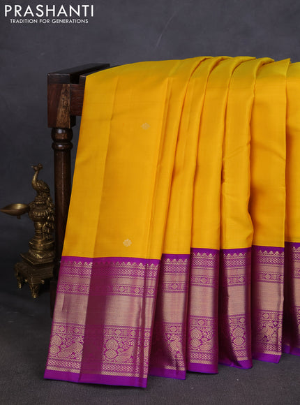 Pure kanchipuram silk saree yellow and purple with zari woven buttas and long zari woven korvai border