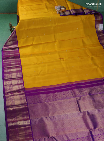 Pure kanchipuram silk saree yellow and purple with zari woven buttas and long zari woven korvai border