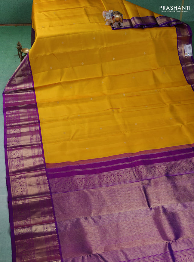 Pure kanchipuram silk saree yellow and purple with zari woven buttas and long zari woven korvai border