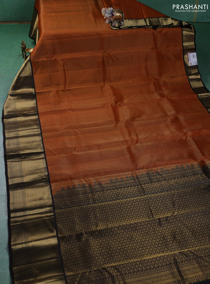 Pure kanchipuram silk saree orange and coffee brown with allover zari checked pattern and long zari woven korvai border