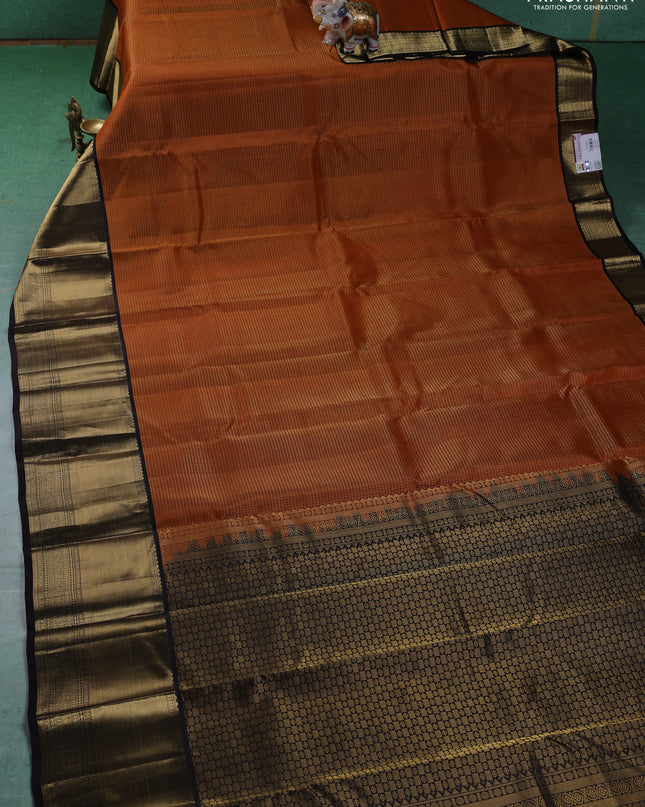 Pure kanchipuram silk saree orange and coffee brown with allover zari checked pattern and long zari woven korvai border
