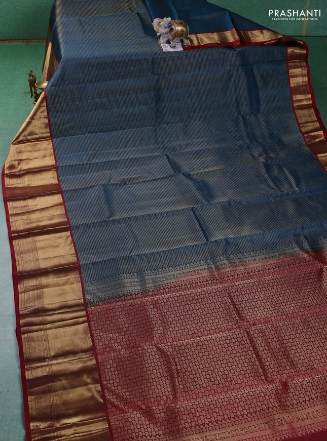 Pure kanchipuram silk saree peacock blue and maroon with allover zari checked pattern and long zari woven korvai border