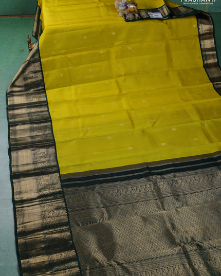 Pure kanchipuram silk saree lime yellow and dark green with zari woven buttas and long zari woven korvai border