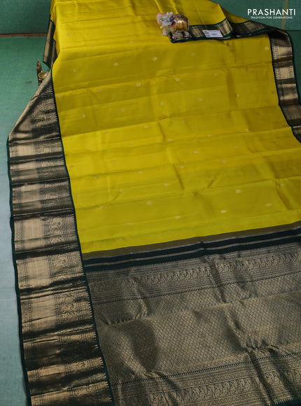 Pure kanchipuram silk saree lime yellow and dark green with zari woven buttas and long zari woven korvai border