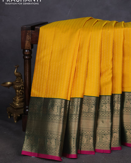 Pure kanchipuram silk saree yellow and dark green with allover zari woven butta weaves and long zari woven korvai border