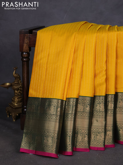 Pure kanchipuram silk saree yellow and dark green with allover zari woven butta weaves and long zari woven korvai border