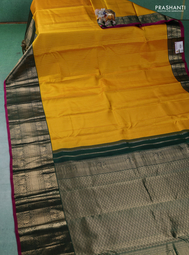 Pure kanchipuram silk saree yellow and dark green with allover zari woven butta weaves and long zari woven korvai border
