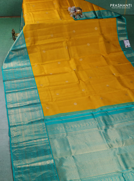 Pure kanchipuram silk saree lime yellow and teal blue with zari woven buttas and long zari woven korvai border