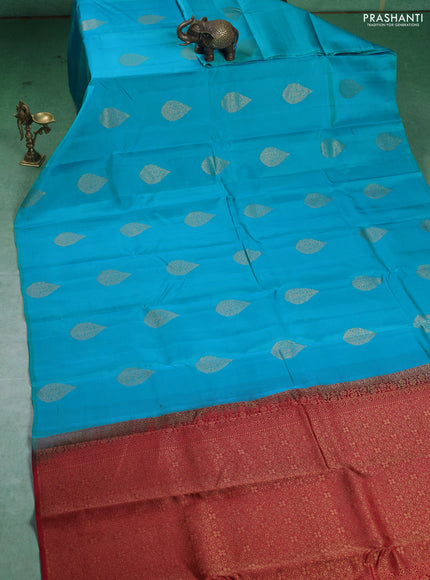 Kanchipuram silk saree teal blue and red with zari woven buttas in borderless style