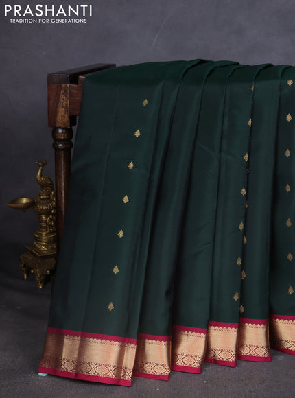 Kanchipuram silk saree dark green and dark pink with zari woven buttas and zari woven simple border