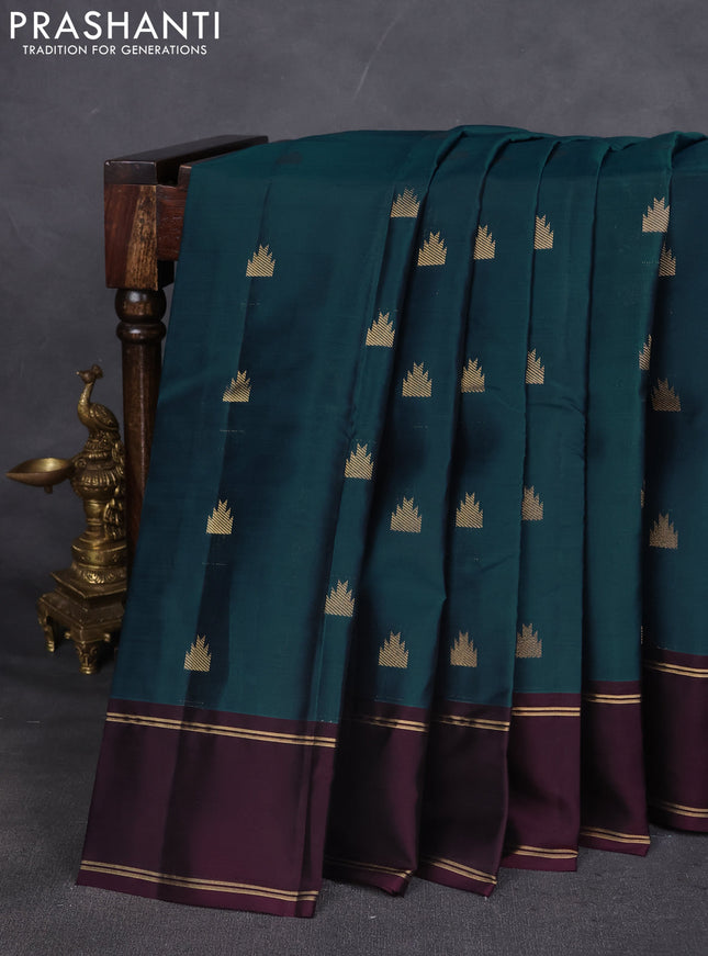 Kanchipuram silk saree peacock green and deep wine with temple zari woven buttas and rettapet zari woven border