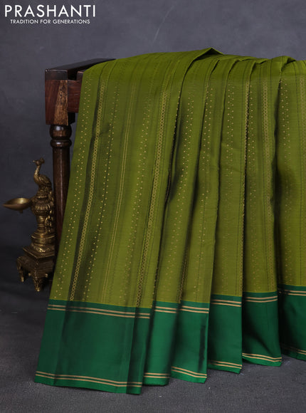 Kanchipuram silk saree mehendi green and green with self emboss & zari weaves and rettapet zari woven border