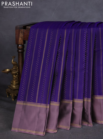 Kanchipuram silk saree blue and pastel lavender with allover zari weaves and rettapet zari woven border