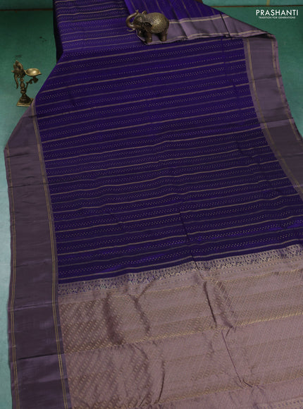 Kanchipuram silk saree blue and pastel lavender with allover zari weaves and rettapet zari woven border