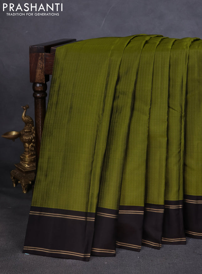 Kanchipuram silk saree mehendi green and coffee brown with allover zari weaves and rettapet zari woven border