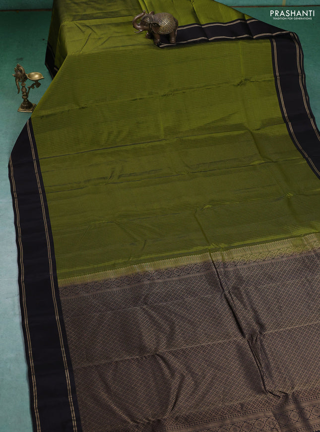Kanchipuram silk saree mehendi green and coffee brown with allover zari weaves and rettapet zari woven border
