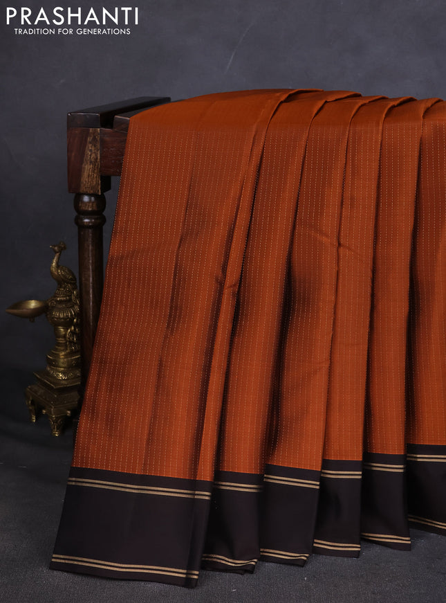 Kanchipuram silk saree rustic orange and deep coffee brown with allover zari weaves and rettapet zari woven border