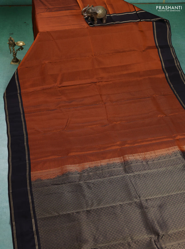 Kanchipuram silk saree rustic orange and deep coffee brown with allover zari weaves and rettapet zari woven border