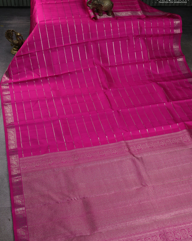 Pure Soft silk saree rani pink with allover silver zari stripes pattern and silver zari woven border