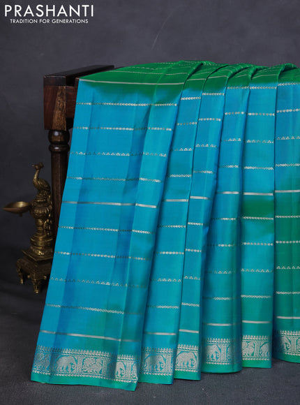 Pure Soft silk saree teal blue with allover silver zari stripes pattern and silver zari woven border