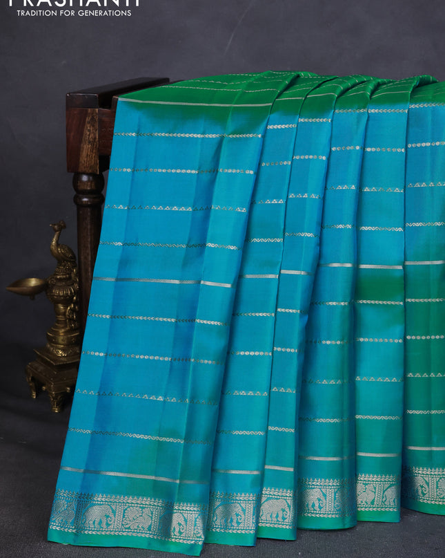Pure Soft silk saree teal blue with allover silver zari stripes pattern and silver zari woven border