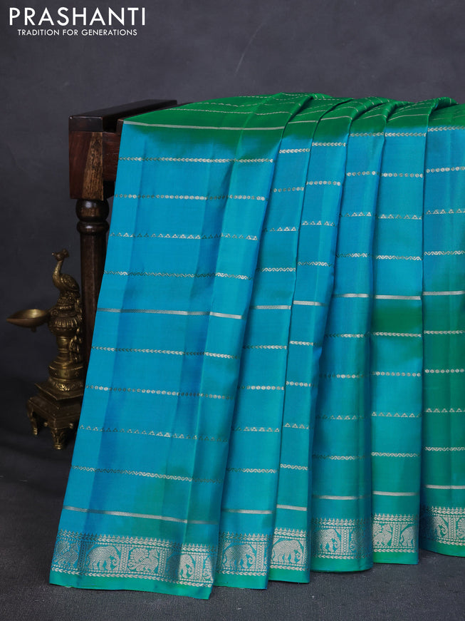 Pure Soft silk saree teal blue with allover silver zari stripes pattern and silver zari woven border