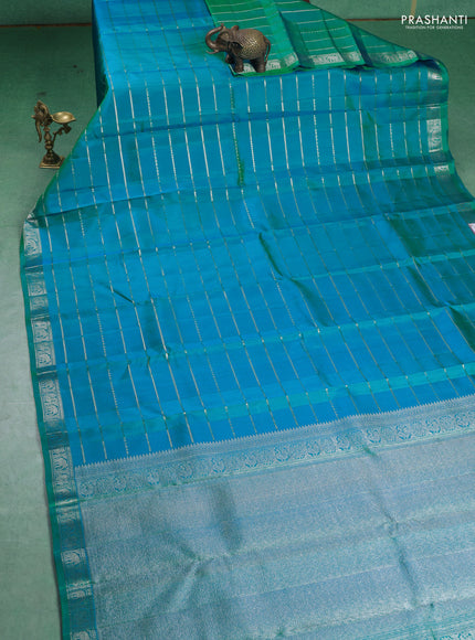 Pure Soft silk saree teal blue with allover silver zari stripes pattern and silver zari woven border