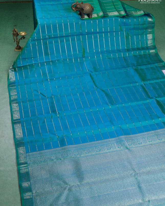 Pure Soft silk saree teal blue with allover silver zari stripes pattern and silver zari woven border