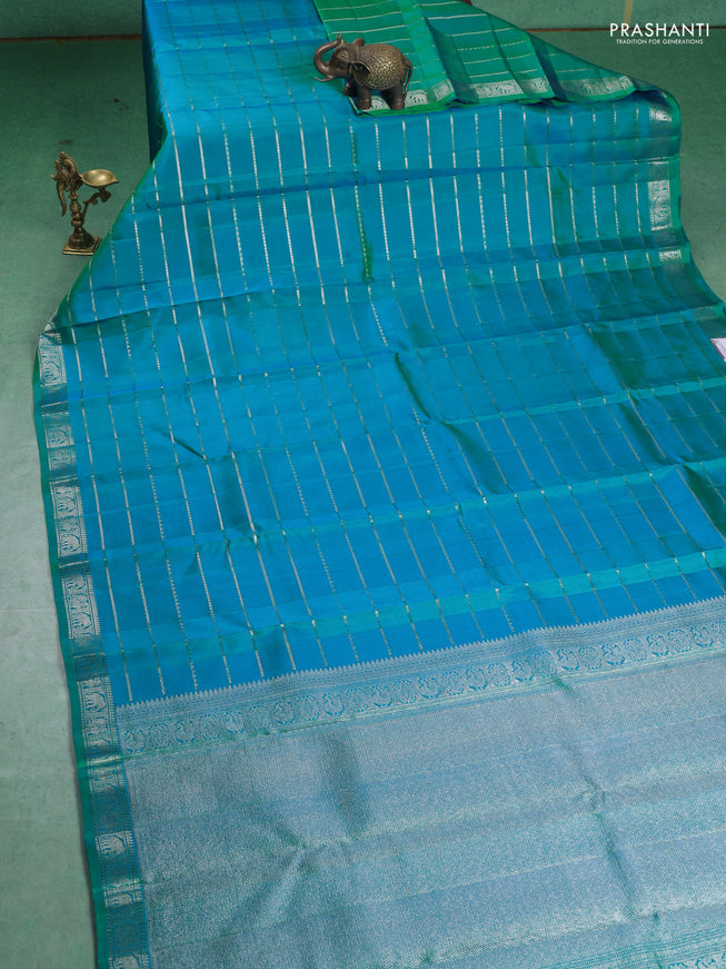 Pure Soft silk saree teal blue with allover silver zari stripes pattern and silver zari woven border