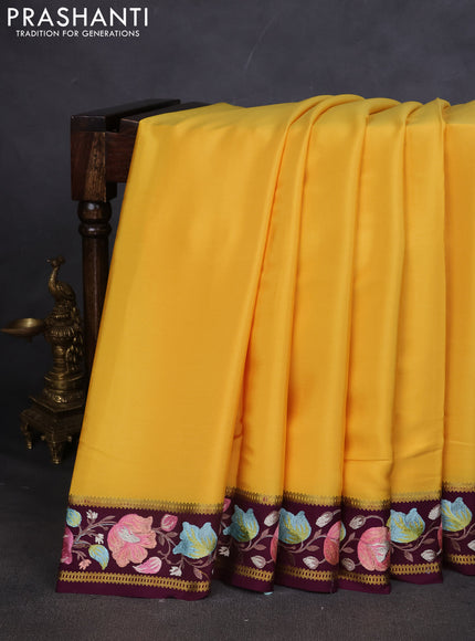 Pure mysore silk saree yellow and deep purple with plain body and embroided border