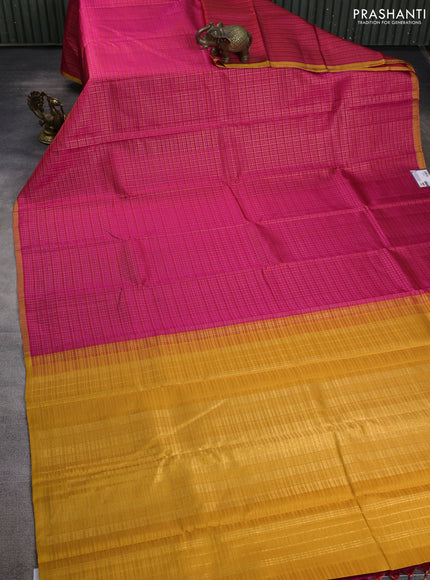 Pure kanchipuram silk saree pink and mustard yellow with allover zari checked pattern and piping border