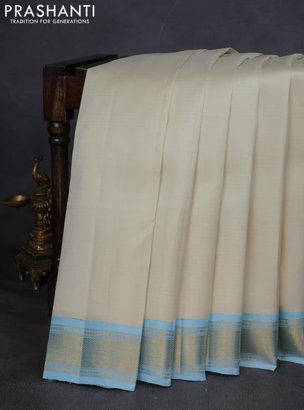 Pure kanchipuram silk saree off white and pastel blue with allover stripes pattern and zari woven korvai border