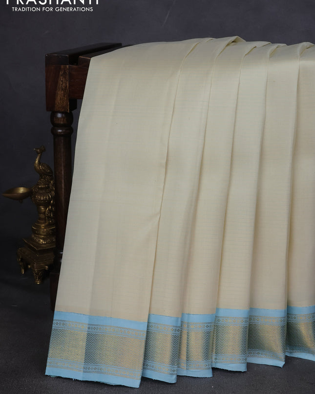 Pure kanchipuram silk saree off white and pastel blue with allover stripes pattern and zari woven korvai border