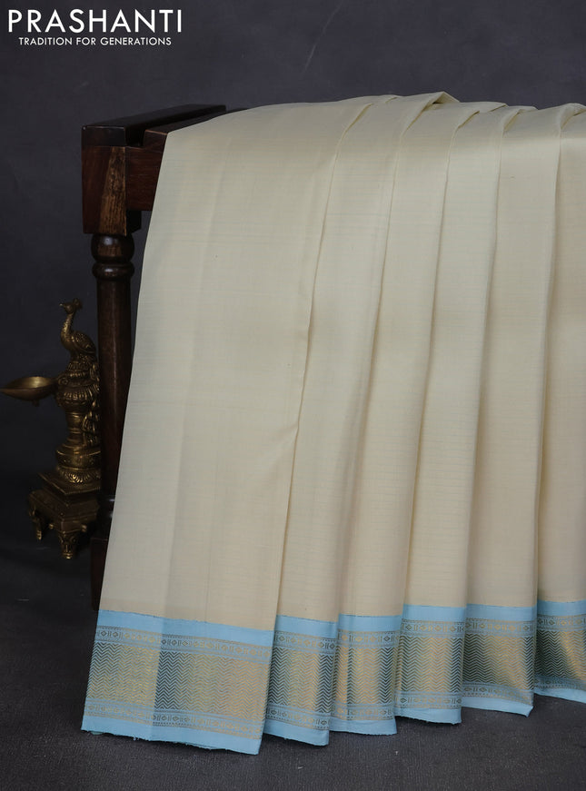 Pure kanchipuram silk saree off white and pastel blue with allover stripes pattern and zari woven korvai border