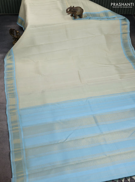 Pure kanchipuram silk saree off white and pastel blue with allover stripes pattern and zari woven korvai border