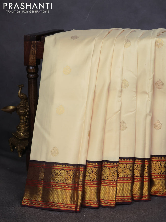 Pure kanchipuram silk saree off white and coffee brown with zari woven buttas and zari woven korvai border