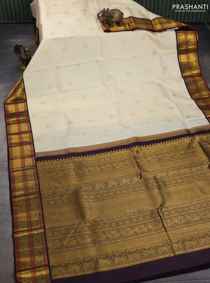 Pure kanchipuram silk saree off white and coffee brown with zari woven buttas and zari woven korvai border