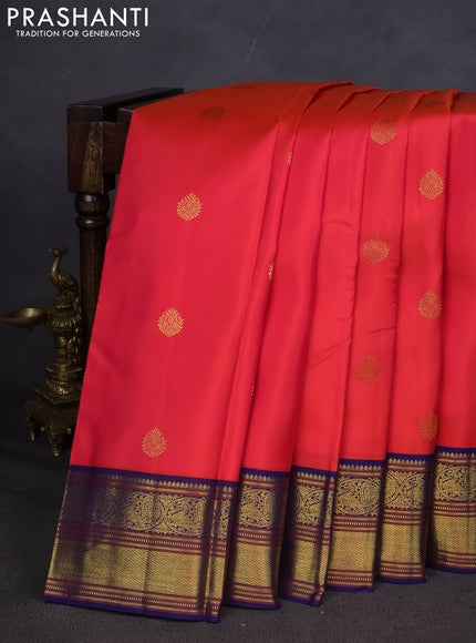 Pure kanchipuram silk saree pinkish orange and blue with zari woven buttas and zari woven korvai border