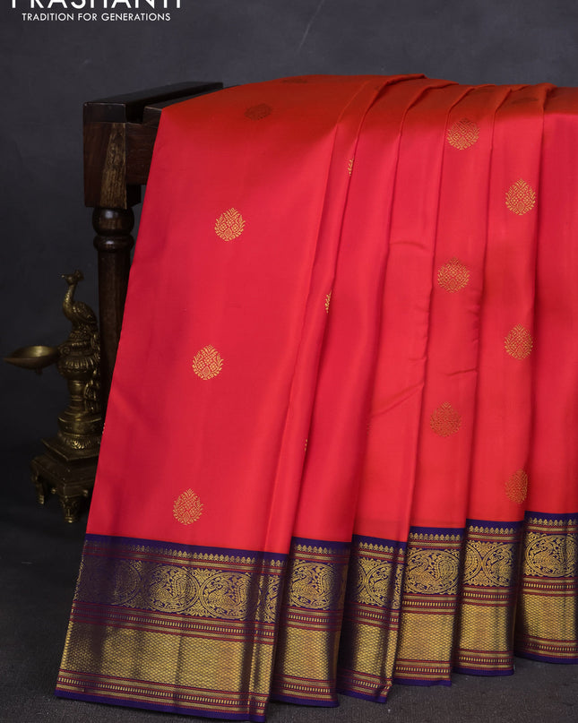 Pure kanchipuram silk saree pinkish orange and blue with zari woven buttas and zari woven korvai border